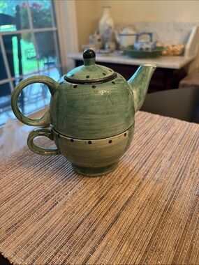 Design Pac teapot and cup set features a stackable, hand-painted green design .